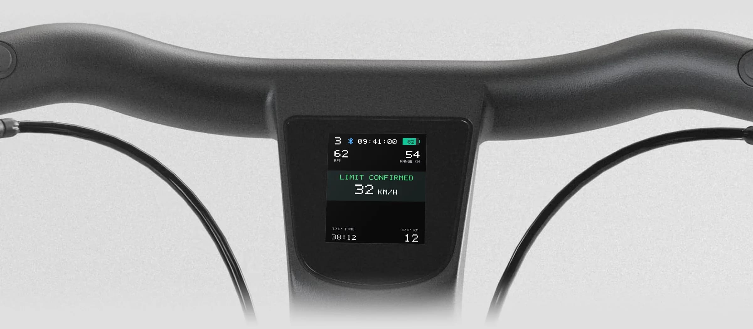Handlebar display confirming a 32 km/h speed limit